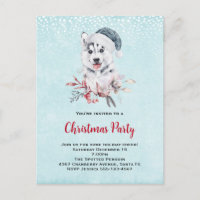 Chien de Noël Husky dans un chapeau de Père Noël