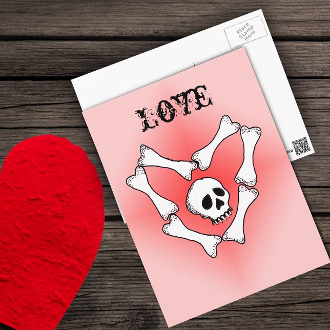 Carte Postale Coeur des os Love Skull PostCard (White skull in white bones in heart shape on red fading to pink Love Valentine postcard.)