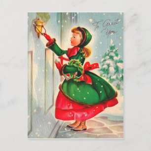 Carte Postale Fille avec la couronne de Noël à la porte