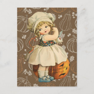 Carte postale Halloween d'une fille sculptant une 