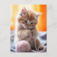Joli petit chat orange jouant avec du fil