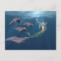 Sirène avec amis dauphins océan