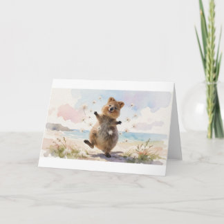 Carte Quokka dansant avec des flocons de graines flottan