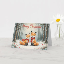 Carte Renard adorable de Noël avec des bois enneigés et