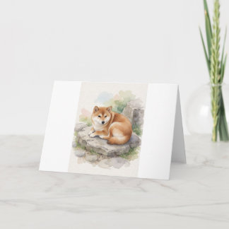 Carte Salutation de Shiba Inu recroquevillé sur la pierr