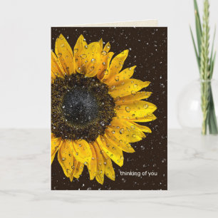 Carte tournesol jaune avec des gouttes de pluie qui pens