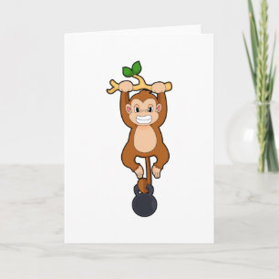 Carte Un singe à l'entraînement de force avec Dumbbell