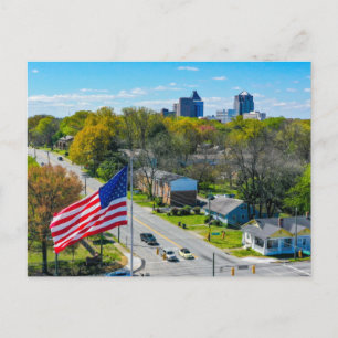 Cartes Pour Fêtes Annuelles Above Greensboro, NC skyline with American Flag