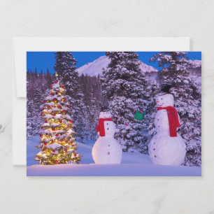 Cartes Pour Fêtes Annuelles Deux Snowmen échangent des cadeaux par arbre