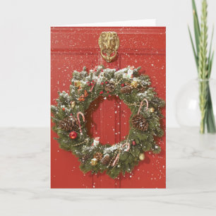 Cartes Pour Fêtes Annuelles Guirlande de Noël accrochant sur une porte