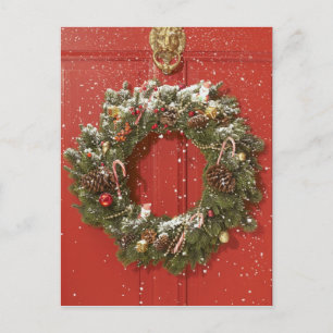Cartes Pour Fêtes Annuelles Guirlande de Noël accrochant sur une porte