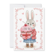 Lapin mignon tenant un cupcake rose