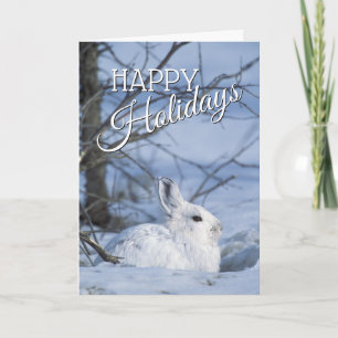 Cartes Pour Fêtes Annuelles Lièvre de raquette reposant dans la neige
