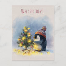 Petit manchot décore un minuscule arbre de Noël,