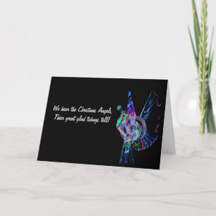 Cartes Pour Fêtes Annuelles Représente un ange éclairé soufflant dans une trom