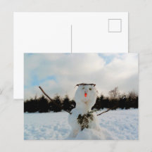Un vrai bonhomme de neige et une photo de paysage 