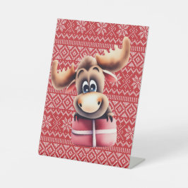 Cartoon Elch mit Weihnachtsgeschenk Sockelschild