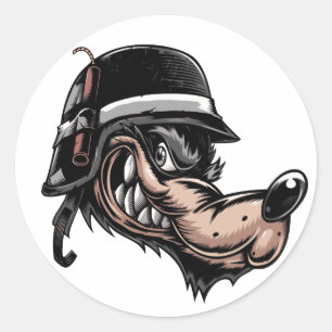 Cartoonwolf mit einem Dynamit auf seinem deutschen Runder Aufkleber