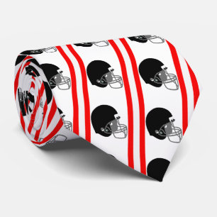 Casque de football noir sur cravate rouge et blanc