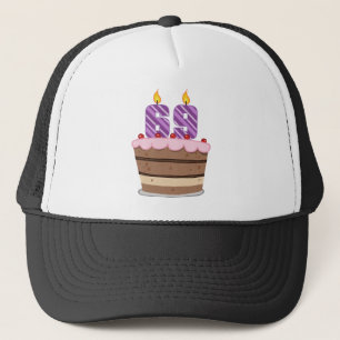 Casquette 69 ans sur le gâteau d'anniversaire