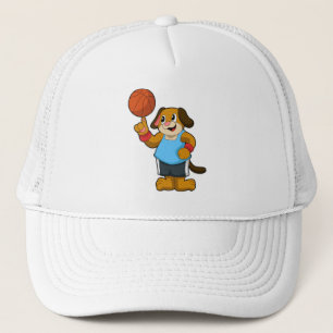 Casquette Chien comme joueur de basket-ball avec basket-ball
