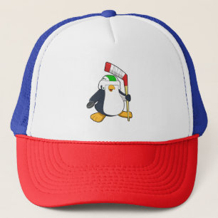 Casquette Pingouin au hockey sur glace avec bâton de hockey 