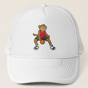 Casquette Singe comme joueur de basket-ball avec basket-ball