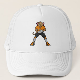 Casquette Singe comme joueur de football avec football