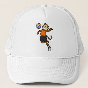 Casquette Singe comme joueur de volleyball avec volleyball