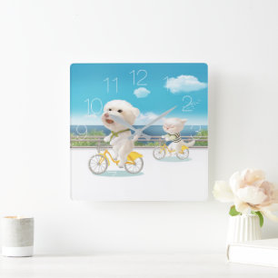 Cat and dog riding bicycle quadratische wanduhr