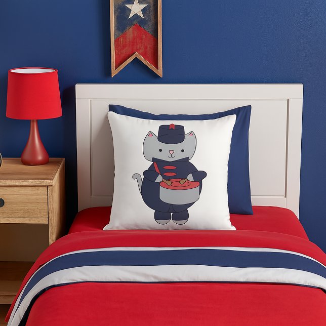 Cat Marching Band Drummer Navy Blue Red Kissen (A throw pillow featuring a gray cat playing the drums in a navy blue & red marching band uniform.)