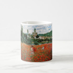 Champ de Monet de tasse rouge de pavots