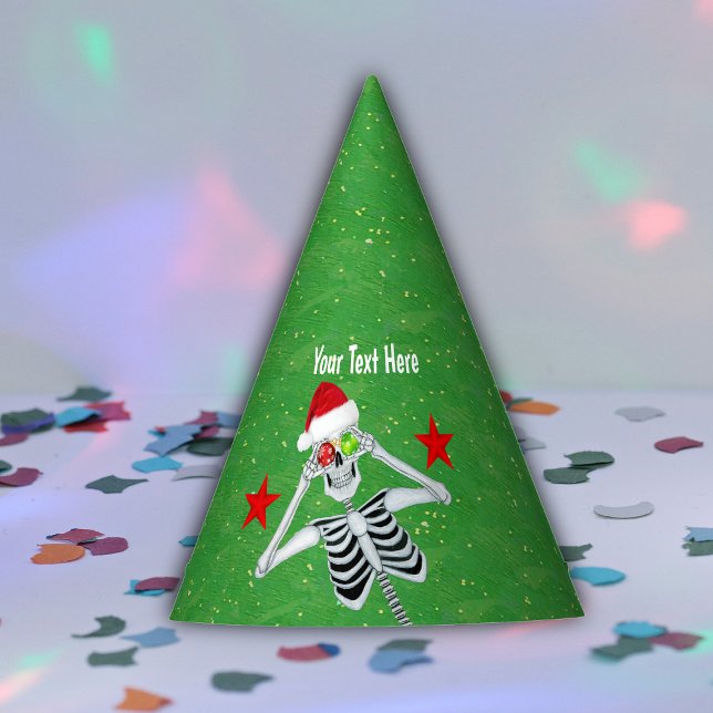 Chapeaux De Fêtes Goofy Skeleton tenant des ornements Santa Hat Gree (Cute Skeleton holding ornaments to eyes red stars on gold speckled green paper party hat.)