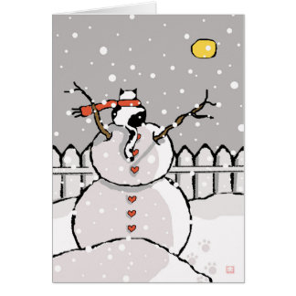 Chat de vacances assis sur la nuit neige de Snowma