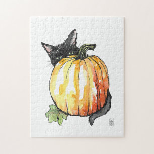 Chat noir derrière le puzzle Citrouille