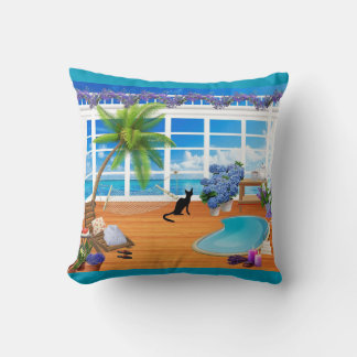 Chat noir et oreiller de plage
