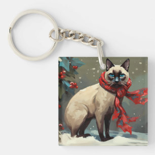 Chat siamois à Noël de neige