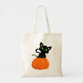 Chat sur un sac fourre-tout à citrouille