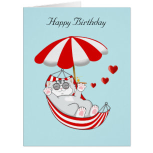 Chaton d'anniversaire dans un hamac sur fond bleu