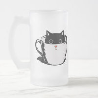 Chaton noir avec nez rouge caché dans une tasse