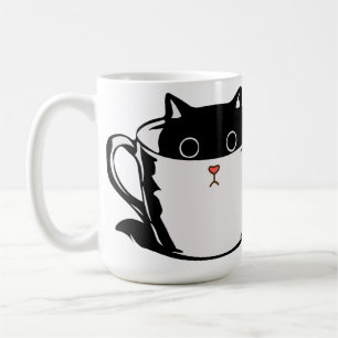 Chaton noir avec nez rouge caché dans une tasse