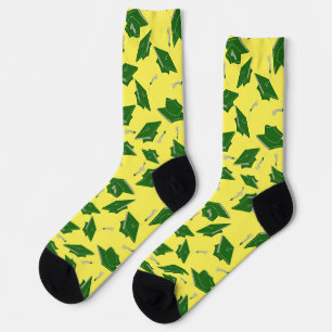 Chaussette Casquettes de graduation verte jetées dans l'air s