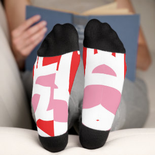 Chaussette un motif rouge et blanc avec une fleur