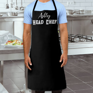 Chef im eigenen schwarzen und weißen Küchendesign Schürze