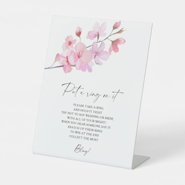 Cherry Blossom - Frühjahr setzt Ring auf sein Spie Sockelschild (Vorderseite)