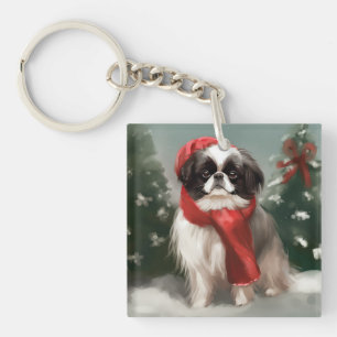 Chien Japonais Chin dans la neige de Noël