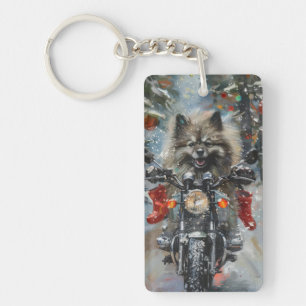 Chien Keeshond en moto Noël