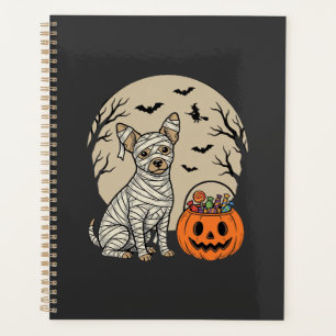 Chien momie d'Halloween et bonbons citrouille