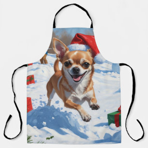 Chihuahua läuft im Schnee mit Weihnachtsmütze Schürze