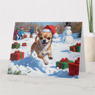 Chihuahua läuft in Schnee mit Weihnachtshut Karte
